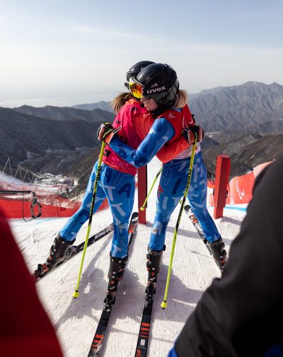 Martina Vozza ITA and her guide, Ylenia Sabidussi, hug before competing in the Women's Super-G Vision Impaired Para Alpine Skiing at the Yanqing National Alpine Skiing Centre. Beijing 2022 Winter Paralympic Games, Yanqing, China, Sunday 06 March 2022. Photo: OIS/Simon Bruty. Handout image supplied by OIS/IOC